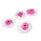 Four round mesh gauze pads with white edges and pink puffed centers