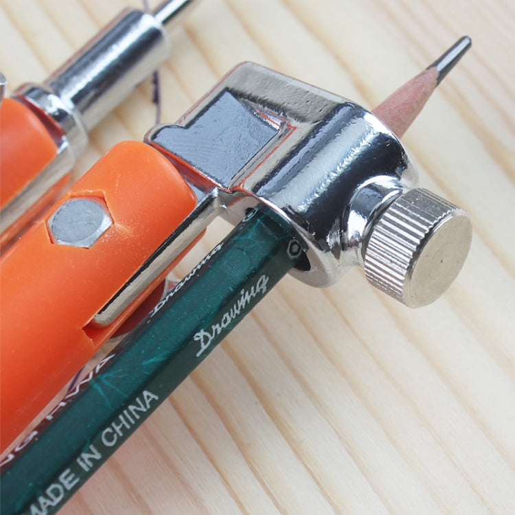 Stainless metal clamp and orange housing on a circle drawing compass
