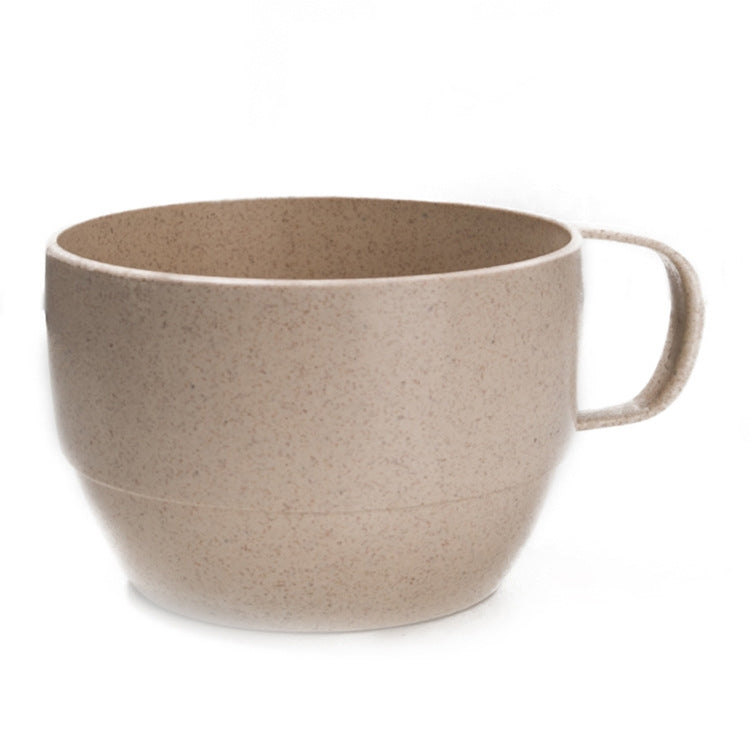Beige wheat straw coffee cup with side handle, speckled finish.