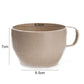 Beige wheat straw coffee cup with handle, speckled; 9.5cm wide, 7cm tall.