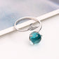 Open silver ring with turquoise round gemstone and fish-tail motif