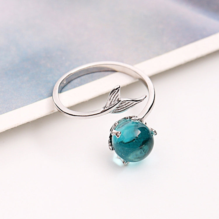 Open silver ring with turquoise round gemstone and fish-tail motif