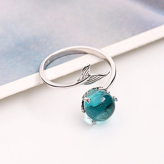 Open silver ring with turquoise round gemstone and fish-tail motif