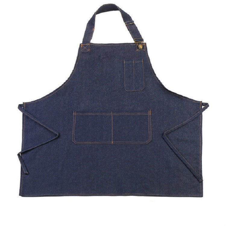 Navy denim halter apron with front pocket and adjustable shoulder straps.