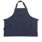Navy denim halter apron with bib panel, wide skirt, and front chest pocket.