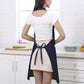Navy denim apron back with waist tie bow and halter neck straps.