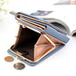 Blue three-fold wallet open with gold clasp, coin pocket, and card holders