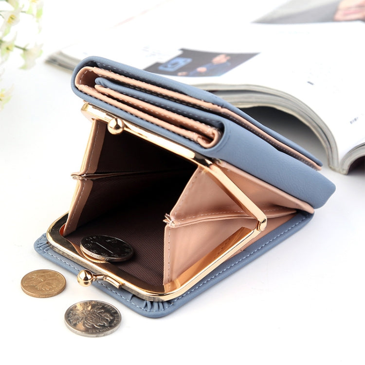Blue three-fold wallet open with gold clasp, coin pocket, and card holders