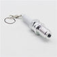 Spark plug LED keychain with chrome body, white plastic insulator, metal keyring
