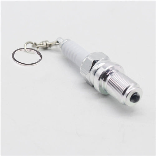 Spark plug LED keychain with chrome body, white plastic insulator, metal keyring
