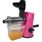 Manual citrus juicer with pink base, black head, clear pulp container, and side crank