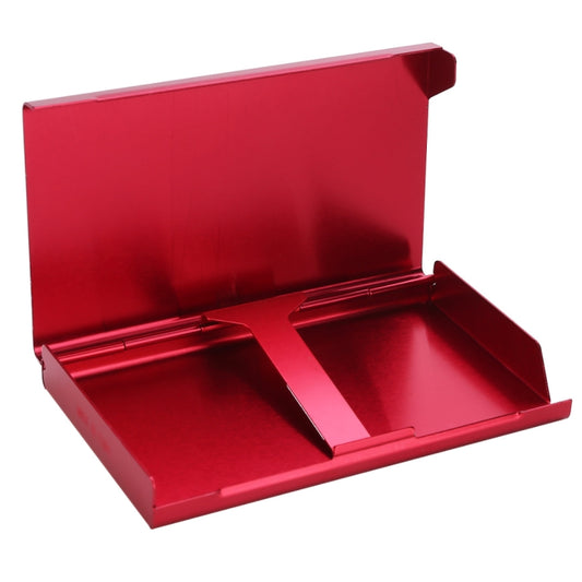 Red metal cigarette case open, showing interior tray and hinge.