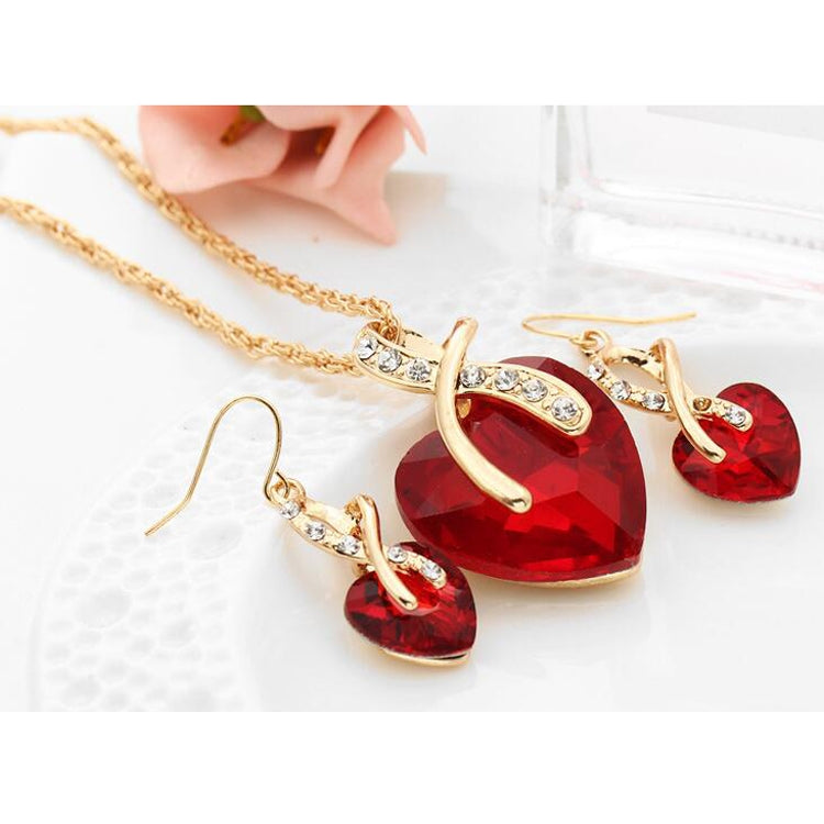 Gold-tone heart jewelry set with red heart pendant necklace and red heart drop earrings