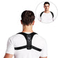 Rear view of black posture corrector brace on white shirt, central padded support panel