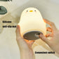 Warm light penguin-shaped silicone night light with switch panel view.