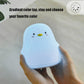 Blue penguin-shaped silicone night light with cute face and gentle glow.