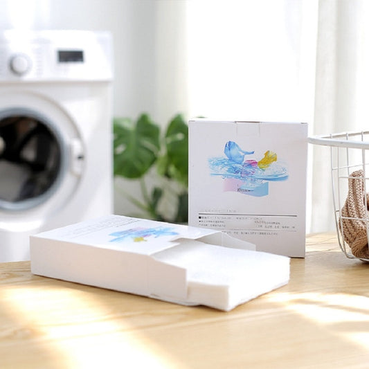 Color absorption laundry film sheets in white boxes with blue splash logo