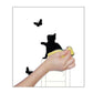 Cat and butterfly wall switch sticker applied to a white switch with butterflies and black cat