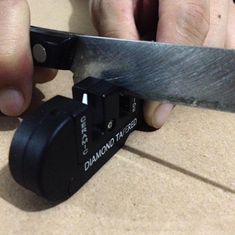 Diamond-tapered knife sharpener tool with metal rod and black sharpening slots