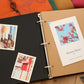 Open black photo album with metal rings and kraft pages featuring photo print inserts.