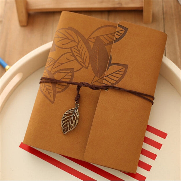 Khaki PU leather vintage photo album with embossed leaves, twine tie, and leaf charm.