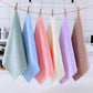 Hanging microfiber face towels on a line, featuring a pink towel