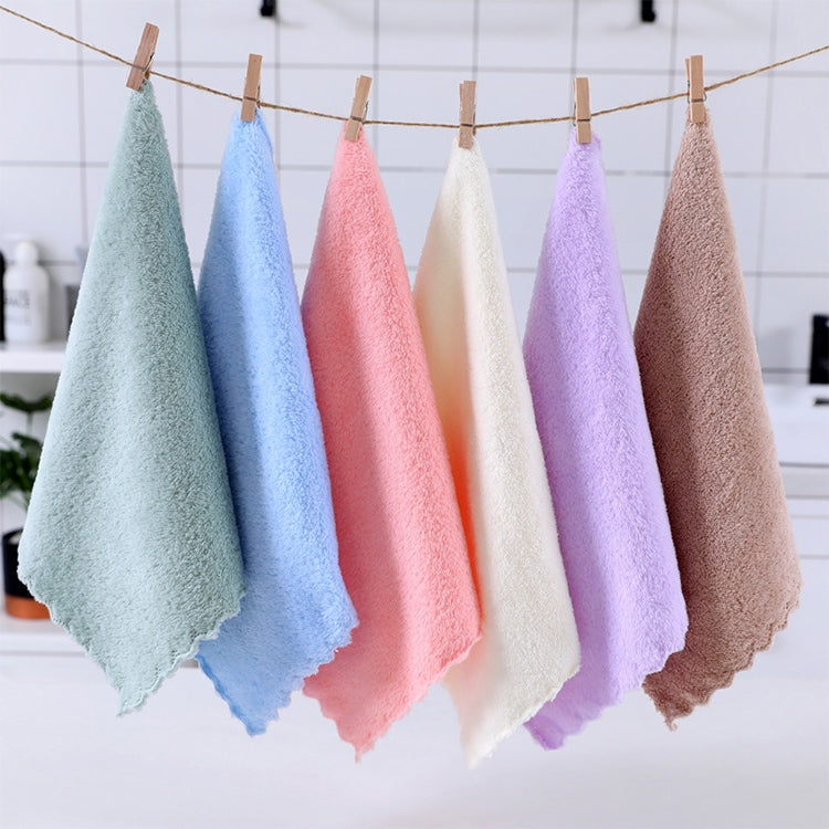 Hanging microfiber face towels on a line, featuring a pink towel