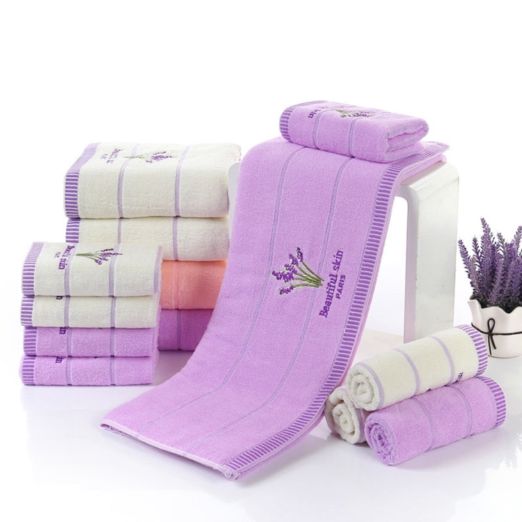 Set of striped face towels in lavender and white, folded with embroidered sprig details