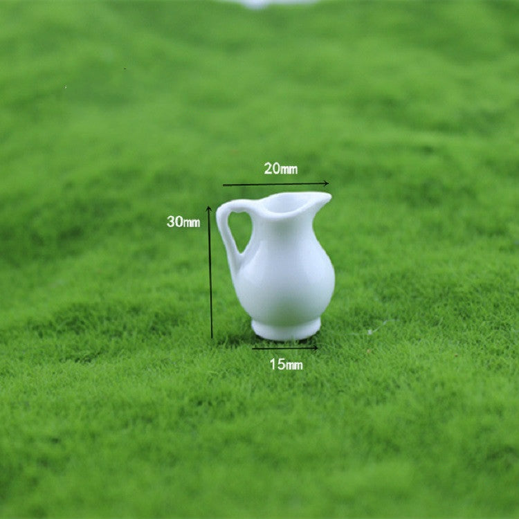 Mini white ceramic vase with wide flared rim and rounded body for dollhouse