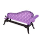 Purple doll sofa with tufted seat back and black base, angled side view