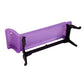 Purple plastic doll sofa profile view with black supports and curved feet