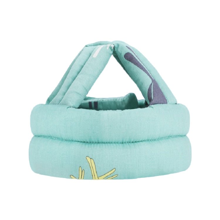 Toddler protective walking helmet cap in mint green fabric with small yellow graphic
