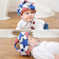 Child wearing toddler protective walking helmet cap with red, white, and blue star pattern