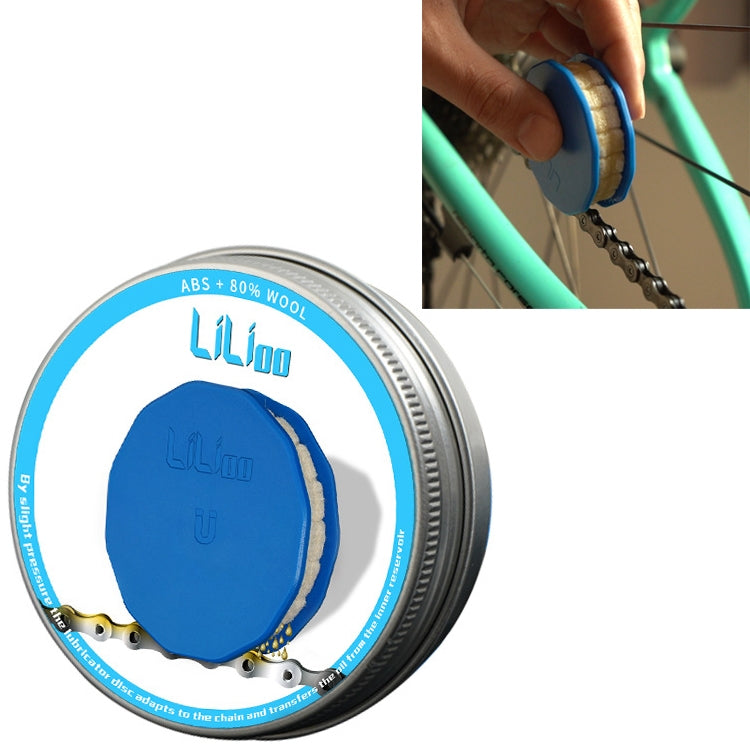 Blue felt roller chain oiler in metal tin, held by hand