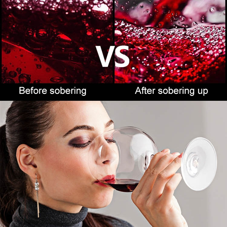 Wine decanter used by a person drinking from a glass with decanter spout
