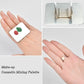 Small square stainless steel mixing palette with makeup swatches on white plate