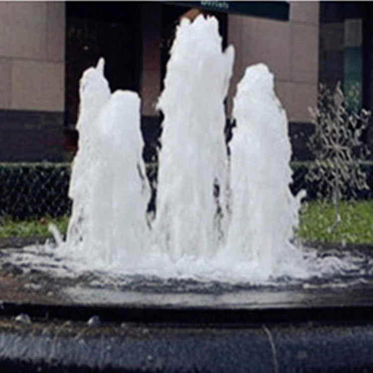Fountain nozzle spraying multiple white water jets in a pond
