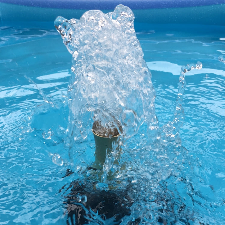 Tall water jet from fountain nozzle with visible splash and droplets