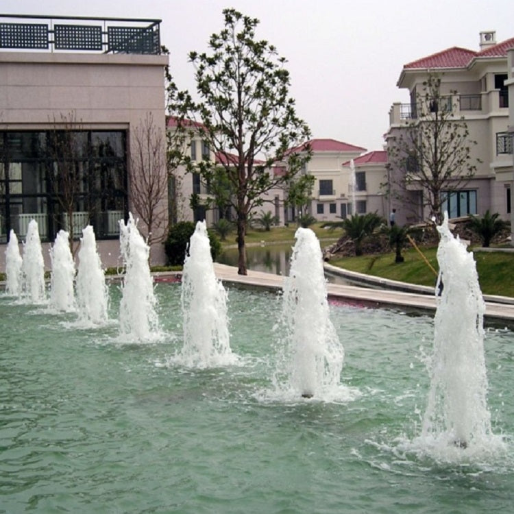 Fountain nozzle producing several vertical water streams in outdoor pool