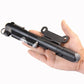 Mini bicycle pump held in hand, showing nozzle and air chamber section