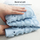 Folded stack of light blue round massage foot mat sheets with raised suction bumps