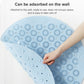 Light blue round massage foot mat laid flat with dense raised suction bumps