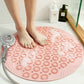 Pink round anti-slip massage foot mat with raised suction bumps for shower floors