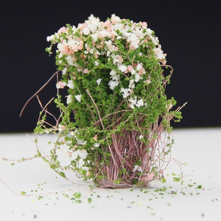 Artificial handmade model flower bush with pink and white blossoms and green foliage