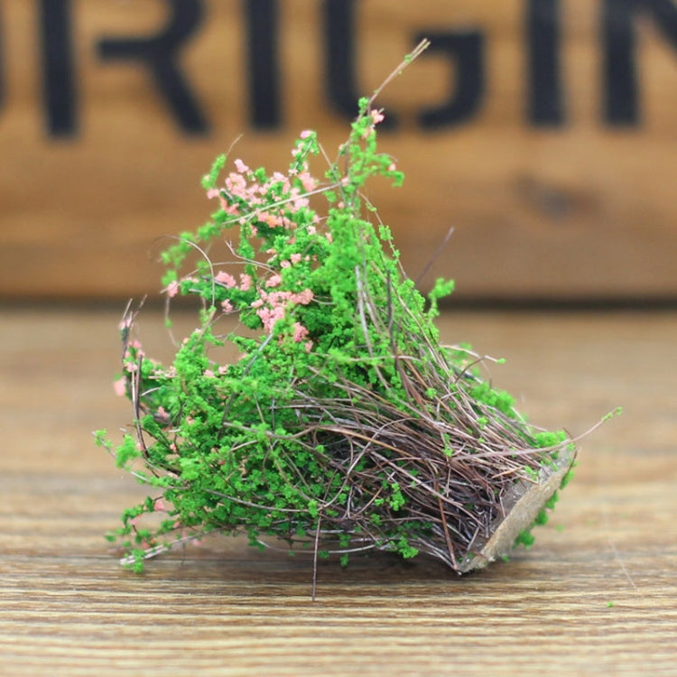 Artificial handmade model flower bush with green leaves and small pink blossoms