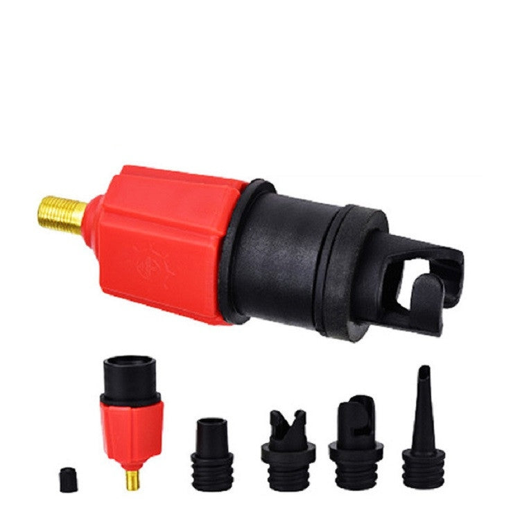 Red air pump valve adapter close-up with gold stem and multiple black nozzle caps