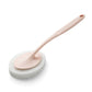 Pink sponge brush with long handle, circular scrubbing head