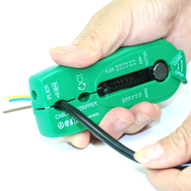 Wire stripper tool held by hand with multi-core cable positioned in jaws