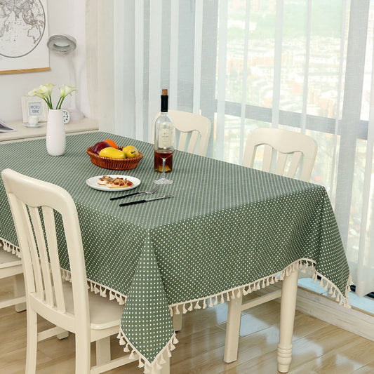 Green cotton tablecloth with small white dots and white tassel fringe for dining tables