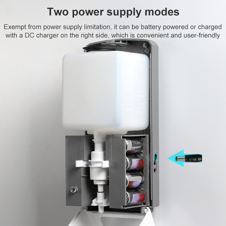 Automatic soap dispenser with open tank showing battery and refill components